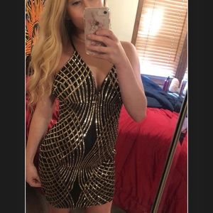 Tight black and gold dress